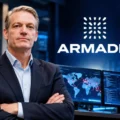 Kevin Mandia, pendiri dan CEO Armadin, dengan latar visual keamanan siber dan identitas perusahaan Armadin.